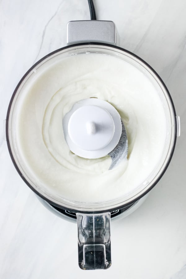 Mini food processor with whipped cottage cheese.